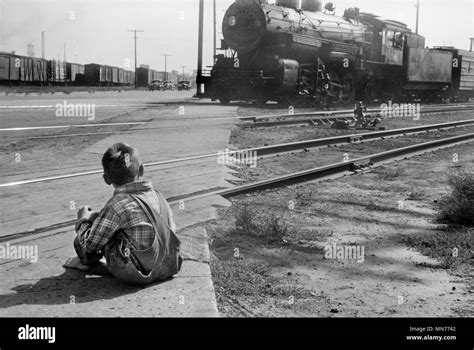 Rear View of Young Boy Watching Freight Train go by, Minneapolis, Minnesota, USA, John Vachon ...