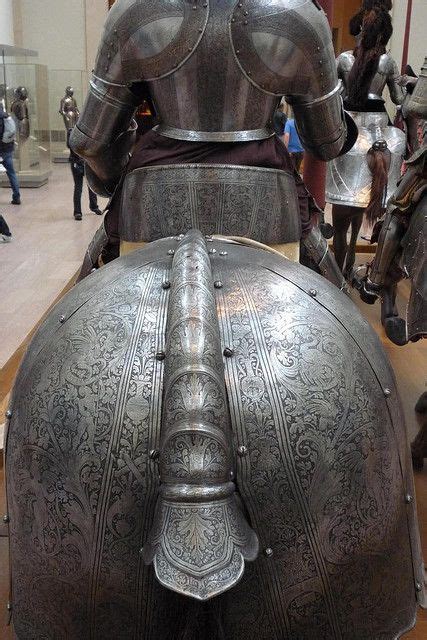 Plate Armour Of Horse And The Knight In Its Saddle From Behind Shows