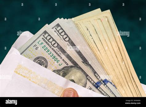 One Hundred Usd Dollar Bills In An Envelope Stock Photo Alamy