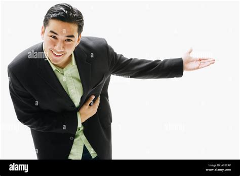 Asian people bowing greeting Cut Out Stock Images & Pictures - Alamy