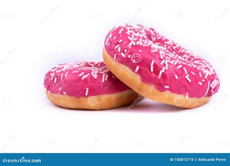 Side View Of Two Donuts With Pink Frosting And White Sprinkles Stock Image Image Of Icing