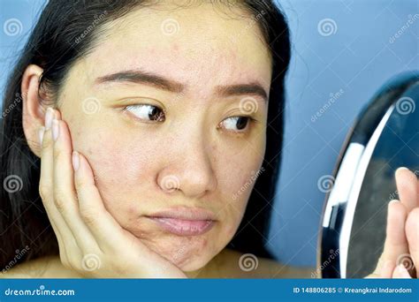 Asian Woman Looking At Herself In The Mirror Female Feeling Annoy