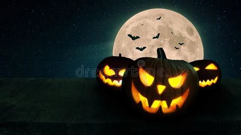 Scary Glowing Pumpkins With Lights On A Wooden Table With A Full Moon And Bats Halloween