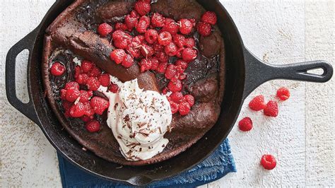 Chocolate Dutch Baby With Raspberries And Whipped Cream Recipe