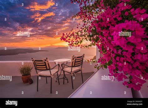 Santorini island sunset. Caldera view with street and flowers, romantic ...