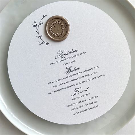 This Custom Round Menu Adorned With A Wax Seal And Floral