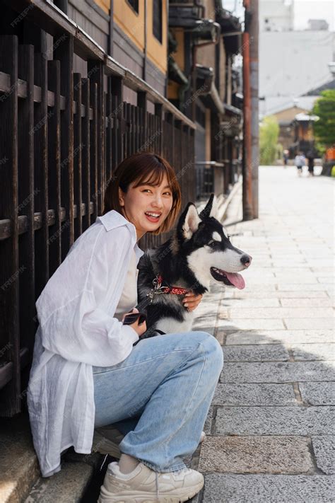 Premium Photo | Full shot asian woman with cute dog