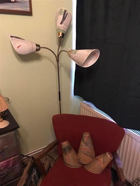 A Lamp That Is On Top Of A Red Chair