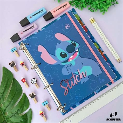 A Notebook With The Word Stitch On It Next To Some Pens And Pencils