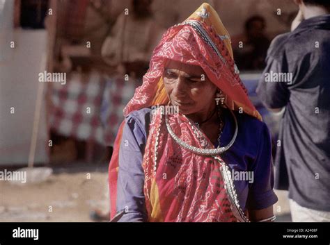 An Old Rajasthani Woman Wearing Traditional Garments And Jewellery