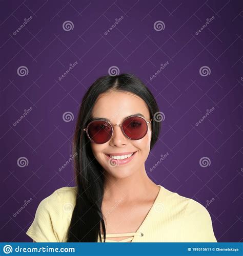 Beautiful Woman Wearing Sunglasses On Purple Background Stock Image Image Of Portrait