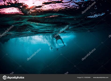 Surfer Girl Surfboard Dive Underwater Ocean Wave Stock Photo By ©keola