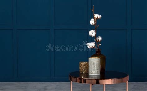 Modern Vases On Metal Copper Side Table In Room With Blue Walls Stock