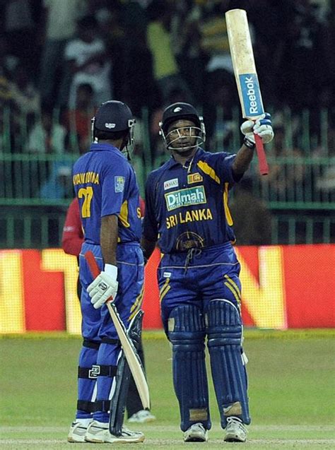 Sanath Jayasuriya raises his bat on reaching 50 | ESPNcricinfo.com