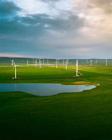 Premium Photo Wind Turbine Farm At Sunset With Dramatic Sky Producing Alernative Energy