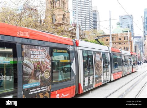 Sydney CBD light rail train at Town Hall station, carriage advertising ...