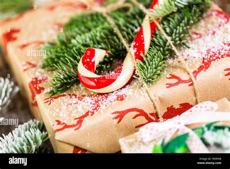 Christmas Gifts Wrapped In Brown Paper With Red Ribbons Stock Photo Alamy