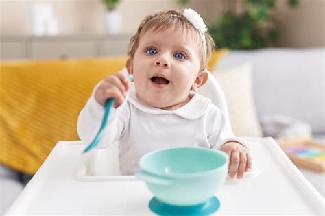 Premium Photo Adorable Blonde Baby Smiling Confident Sitting On