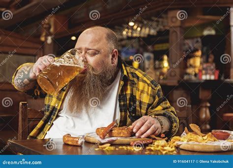 Glad Obese Male Tasting Alcohol In Pub Stock Image Image Of Chew