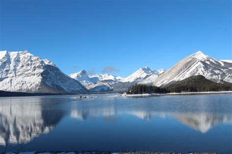 X Resolution Snow Covered Mountains Near Body Of Water During