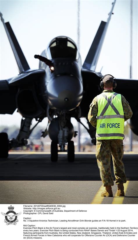 No 3 Squadron Avionics Technician Leading Aircraftman Eirik Blonde Guides An Fa 18 Hornet In