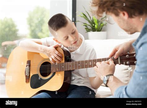 Tutor Boy Playing Guitar Stock Photo Alamy