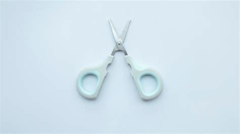 Premium Photo Small Simple Gray Scissor Isolated On White