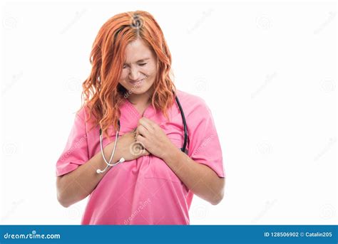 Young Female Doctor With Stethoscope Showing Chest Pain Gesture Stock