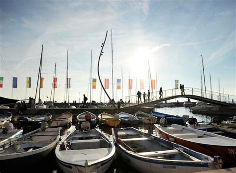 Premium Photo Boats Moored At The Pier In The Port Of Bardolino Lake