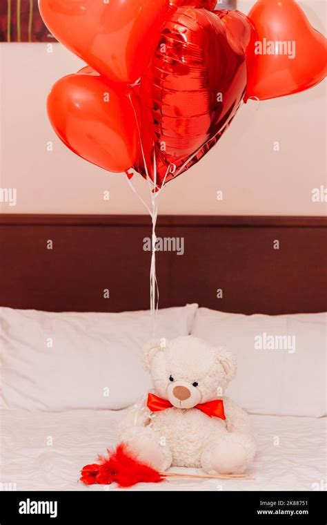 White Teddy Bear With Red Heart Balls On The Couch For Valentine S Day