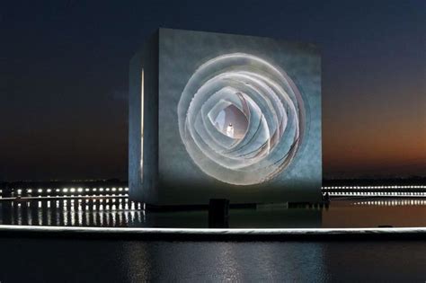 A Large White Sculpture Sitting On Top Of A Body Of Water