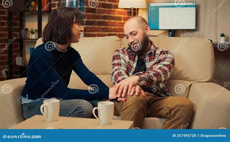 Husband And Wife Solving Marriage Problems At Therapy Session Meeting