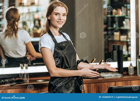 Beautiful Happy Young Female Hairdresser Smiling At Camera Stock Image Image Of Hairsalon