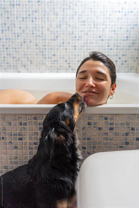 "Woman Taking A Bath And Kissing To Her Dog." by Stocksy Contributor ...