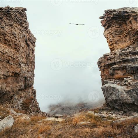 soft focus dangerous gorge  cliff   rocks dramatic fog