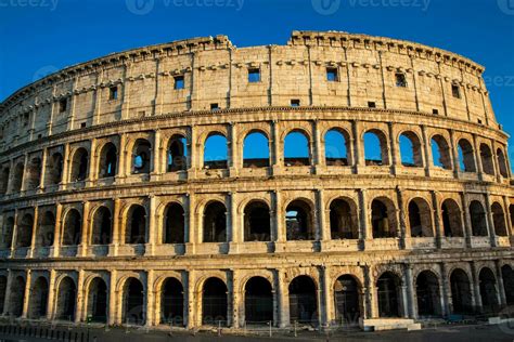 The Famous Colosseum Under The Beautiful Light Of The Golden Hour In