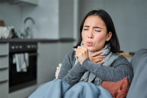 Premium Photo Sick Korean Woman Coughing And Feeling Unwell Grimacing