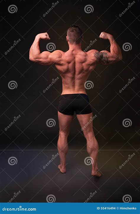 Demonstrates the Strong Man Back Muscles Stock Photo - Image of ...