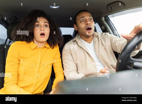 Shocked Middle Eastern Couple In Car Having Traffic Accident Risk Stock