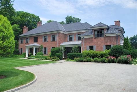 Georgian Colonial home with brick veneer, slate roof, copper gutters