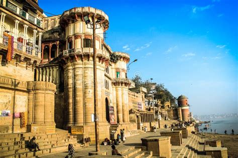 Assi Ghat Varanasi India With Boats Cows And Pedestrians Editorial