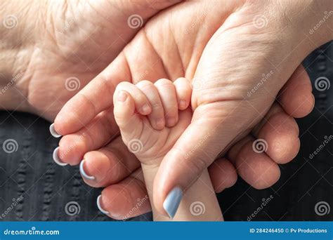 Close Up The Hands Of The Baby Mom And Grandmother Stock Photo