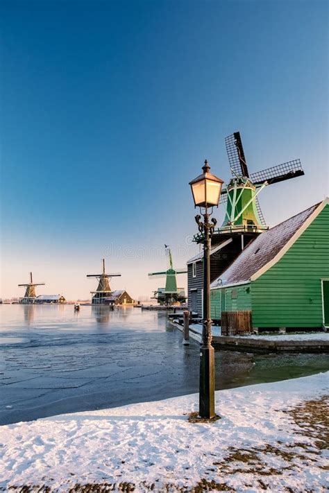 Snow Covered Windmill Village In The Zaanse Schans Netherlands