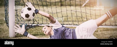 Female goalkeeper saving a goal Stock Photo - Alamy