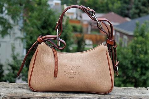 Dooney And Bourke 1975 Small Tan W Brown Trim Leather Hobo Shoulder Hand Bag Leather Hobo