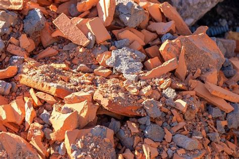 A Pile Of Broken Red Bricks The Remains Of A Destroyed Building