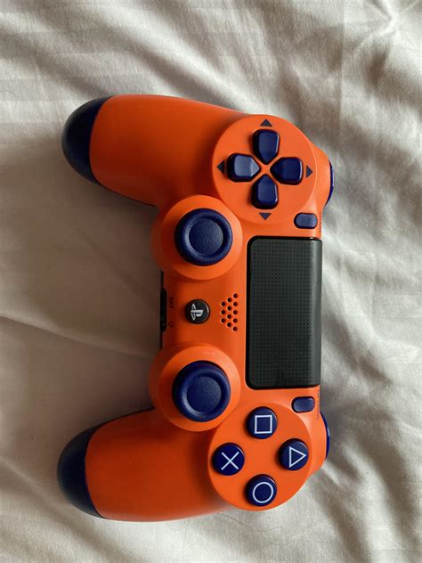 found a genuine sunset orange controller in a games store : r/playstation