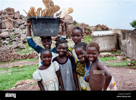 Mali, Africa - Black children carrying food in an african village near Bamako Stock Photo - Alamy