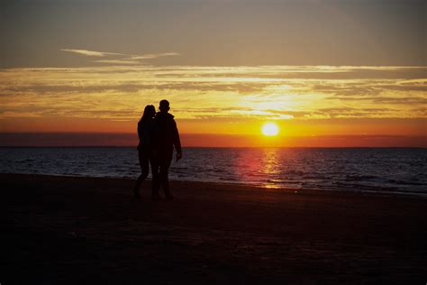 Couple On The Beach Watching The Sunrise Chris Flickr