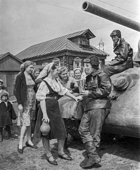 Girls Treat The Crew Of A Soviet T 34 Tank On A Rural Street Date And